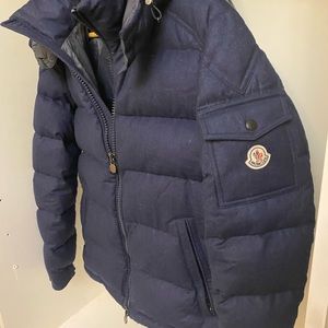 Moncler goose down blue wool jacket with a detachable hood.